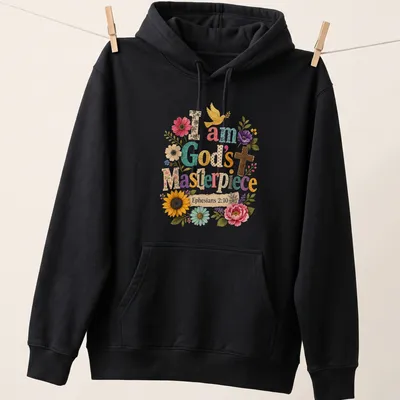 Colorful floral graphic with a cross and dove, featuring printed text about being God's masterpiece — printed on a unisex hoodie