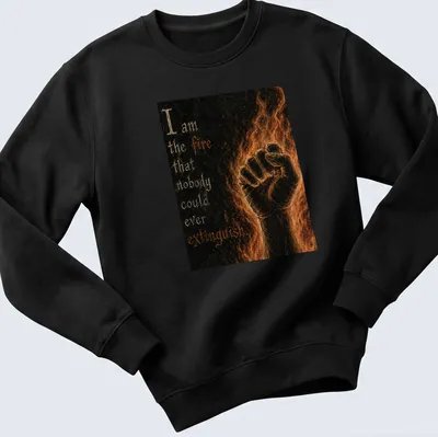 Gothic art T-shirt with a clenched fist and flames, featuring motivational text. — printed on a unisex sweatshirt