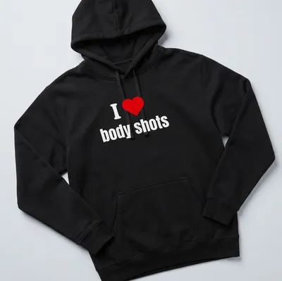 Bold typography shirt with a heart symbol and the phrase I ❤️ body shots. — printed on a unisex hoodie