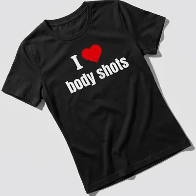 Bold typography shirt with a heart symbol and the phrase I ❤️ body shots. — printed on a women's shirt