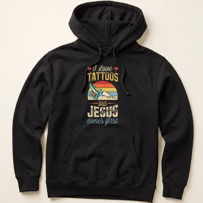 Colorful vintage print of a tattoo machine with text about faith and tattoos — printed on a unisex hoodie