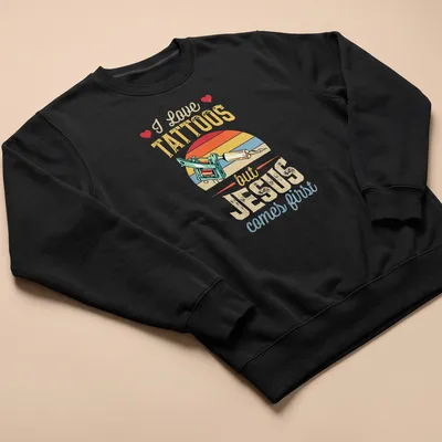 Colorful vintage print of a tattoo machine with text about faith and tattoos — printed on a unisex sweatshirt