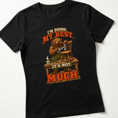 Bear illustration with the text 'I'm Doing My Best. It's Not Much.' in brown, green, and orange. — printed on a women's shirt