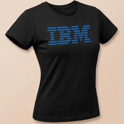 Retro blue IBM logo t-shirt evoking 80s and 90s tech nostalgia — printed on a women's shirt
