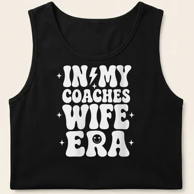 Bold typography t-shirt with IN MY COACHES WIFE ERA text in white — printed on a tank top