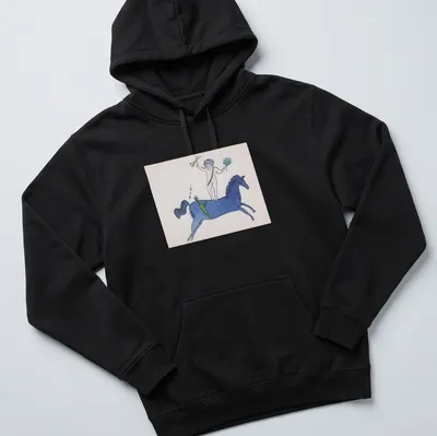 Playful illustration of a nude figure on a blue horse with garden text above. — printed on a unisex hoodie