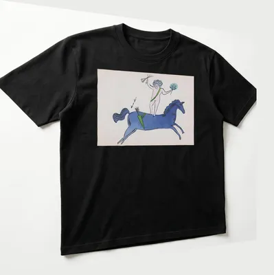 Playful illustration of a nude figure on a blue horse with garden text above. — printed on a unisex t-shirt (angled view)