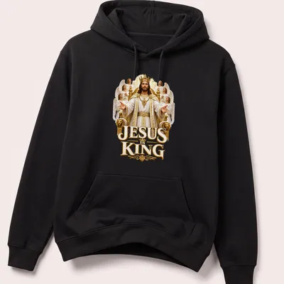 Detailed illustration of crowned Jesus with angels and text JESUS is KING — printed on a unisex hoodie