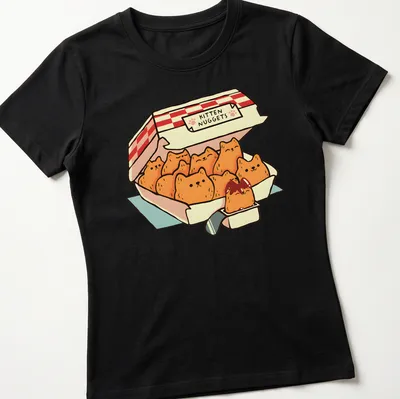 Kawaii line-art design of kittens shaped like chicken nuggets with playful text — printed on a women's shirt