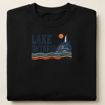 Retro lighthouse sunset illustration on Lake Ontario shirt with navy blue and orange colors. — printed on a unisex sweatshirt