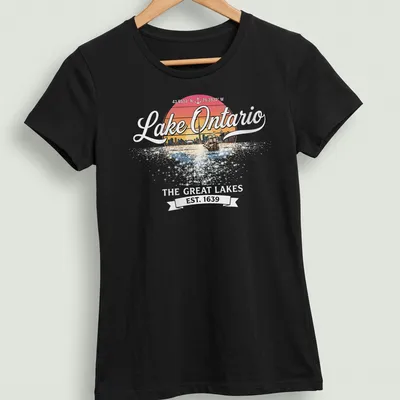 Retro sunset design with a sailing ship and city skyline, featuring Lake Ontario text. — printed on a women's shirt
