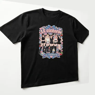 Colorful cartoon design featuring the text LE SSERAFIM and five members of the girl group — printed on a unisex t-shirt (angled view)