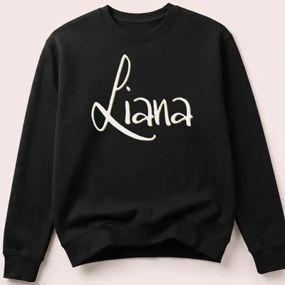 Personalized shirt featuring the name Liana in elegant gold script on white — printed on a unisex sweatshirt