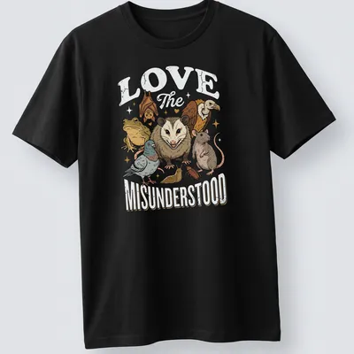 Illustrative t-shirt featuring various misunderstood animals with heartfelt text — printed on a unisex t-shirt