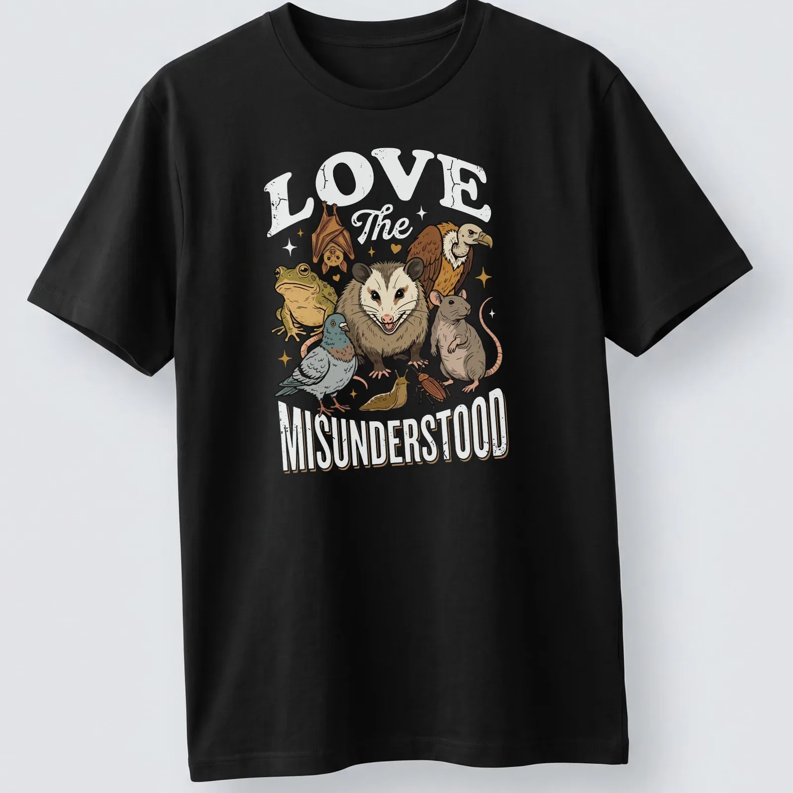 Illustrative t-shirt featuring various misunderstood animals with heartfelt text — printed on a unisex t-shirt