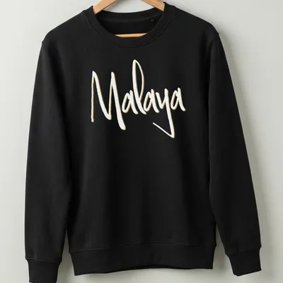 Personalized t-shirt featuring the name Malaya in handwritten modern script — printed on a unisex sweatshirt