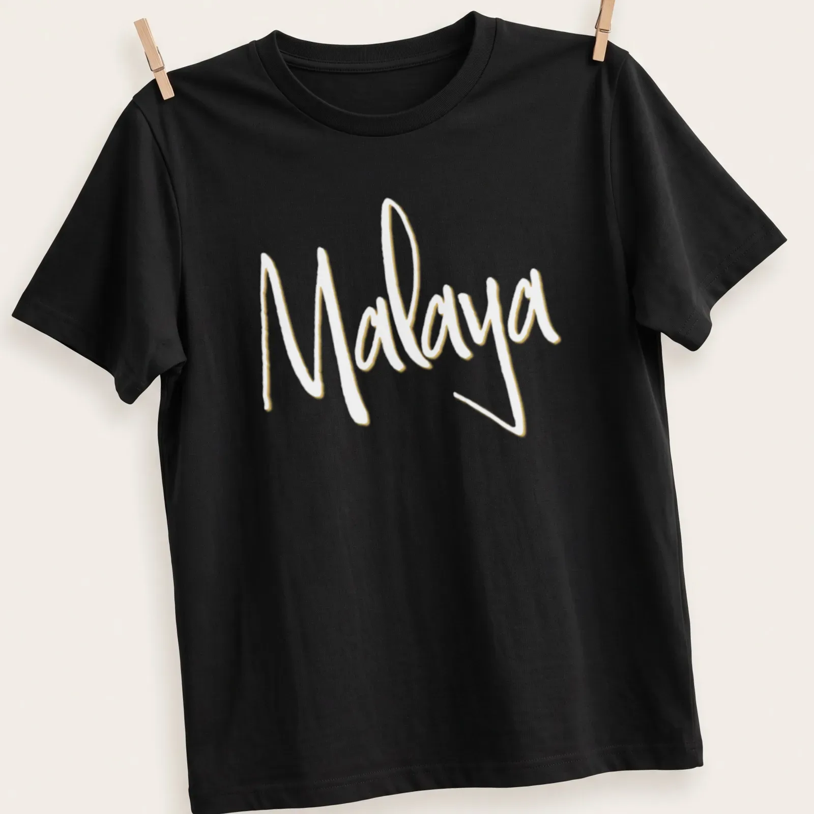 Personalized t-shirt featuring the name Malaya in handwritten modern script — printed on a unisex t-shirt