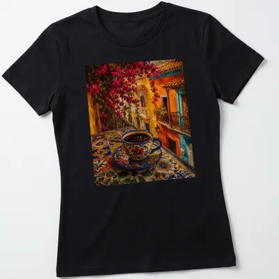 Colorful folk art coffee cup on a vibrant table in blue, orange, pink, yellow, and green — printed on a women's shirt