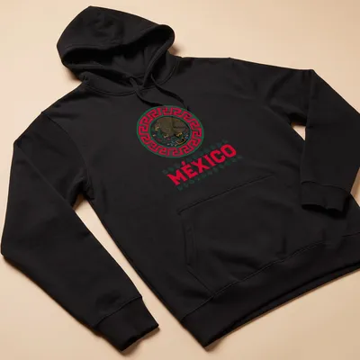 Eagle graphic with the word MÉXICO in bold, traditional colors of red, green, gold, and white. — printed on a unisex hoodie