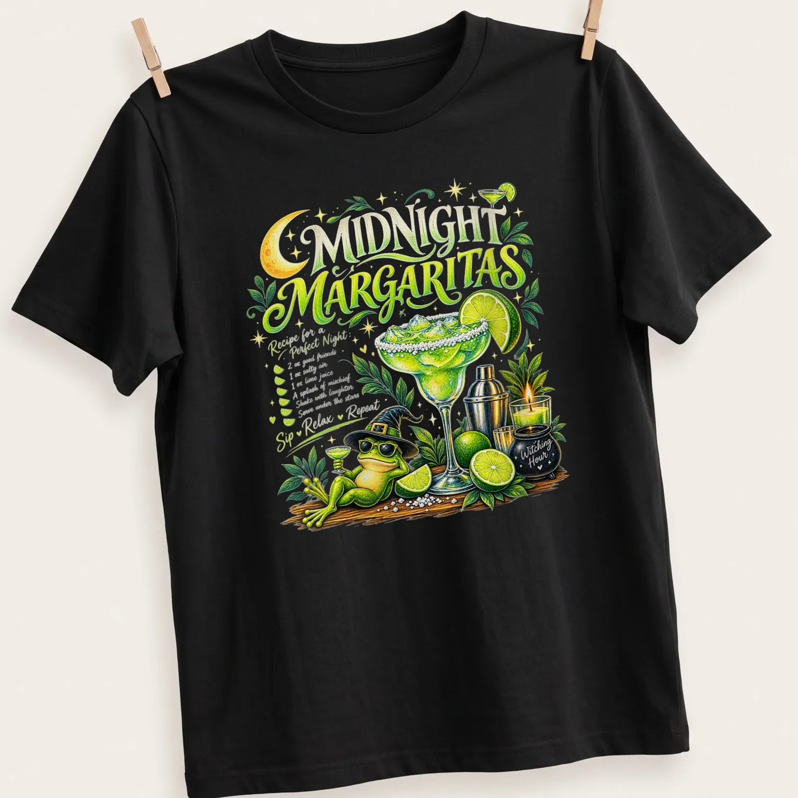 Whimsical graphic of a frog in a witch hat holding a margarita with a recipe text — printed on a unisex t-shirt