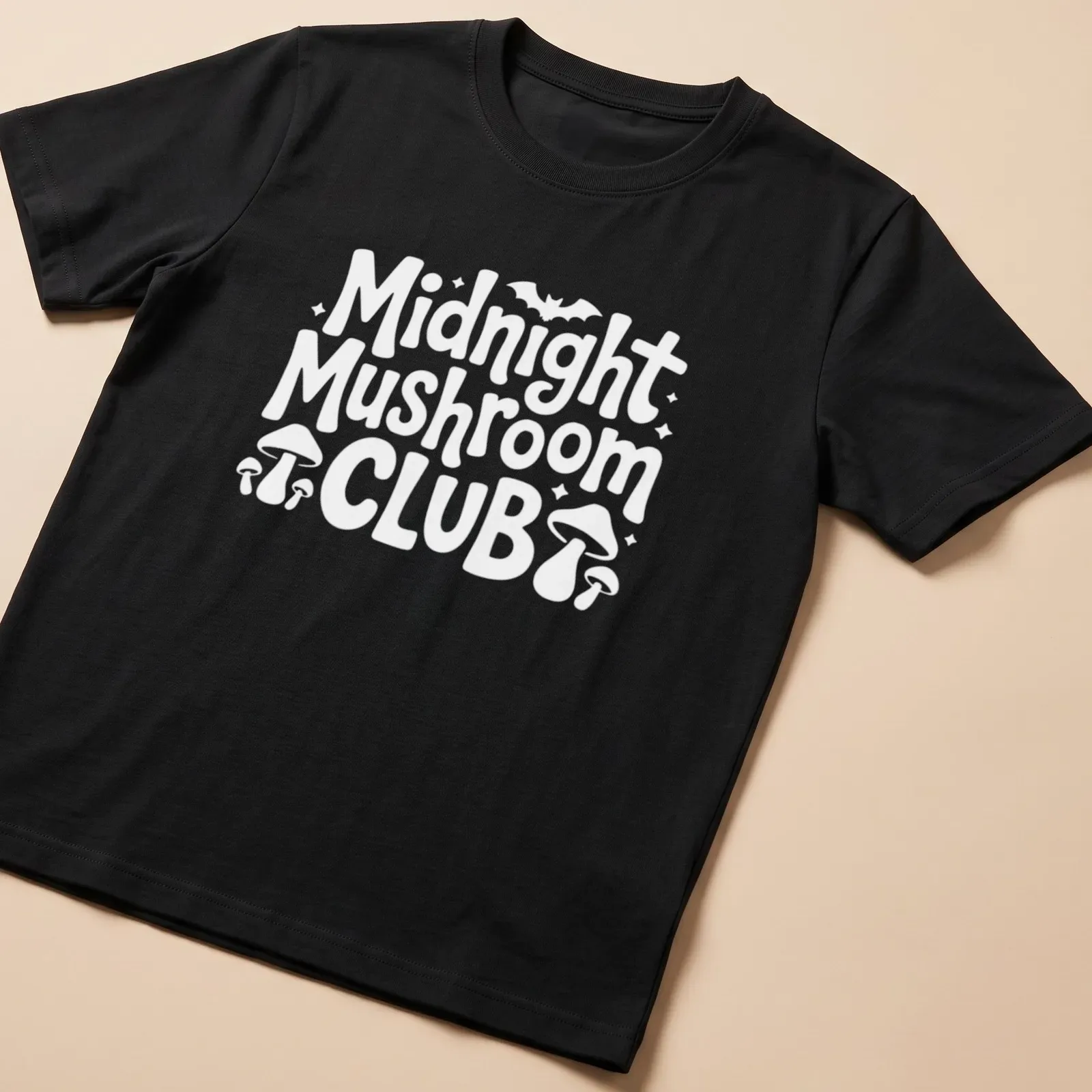 Vintage design featuring mushrooms and text 'Midnight Mushroom Club' in black, white, and purple. — printed on a unisex t-shirt