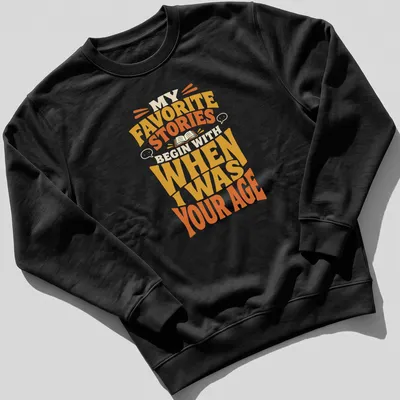 Retro T-shirt featuring a storytelling quote in bold, warm colors. — printed on a unisex sweatshirt