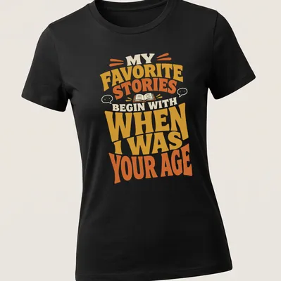 Retro T-shirt featuring a storytelling quote in bold, warm colors. — printed on a women's shirt