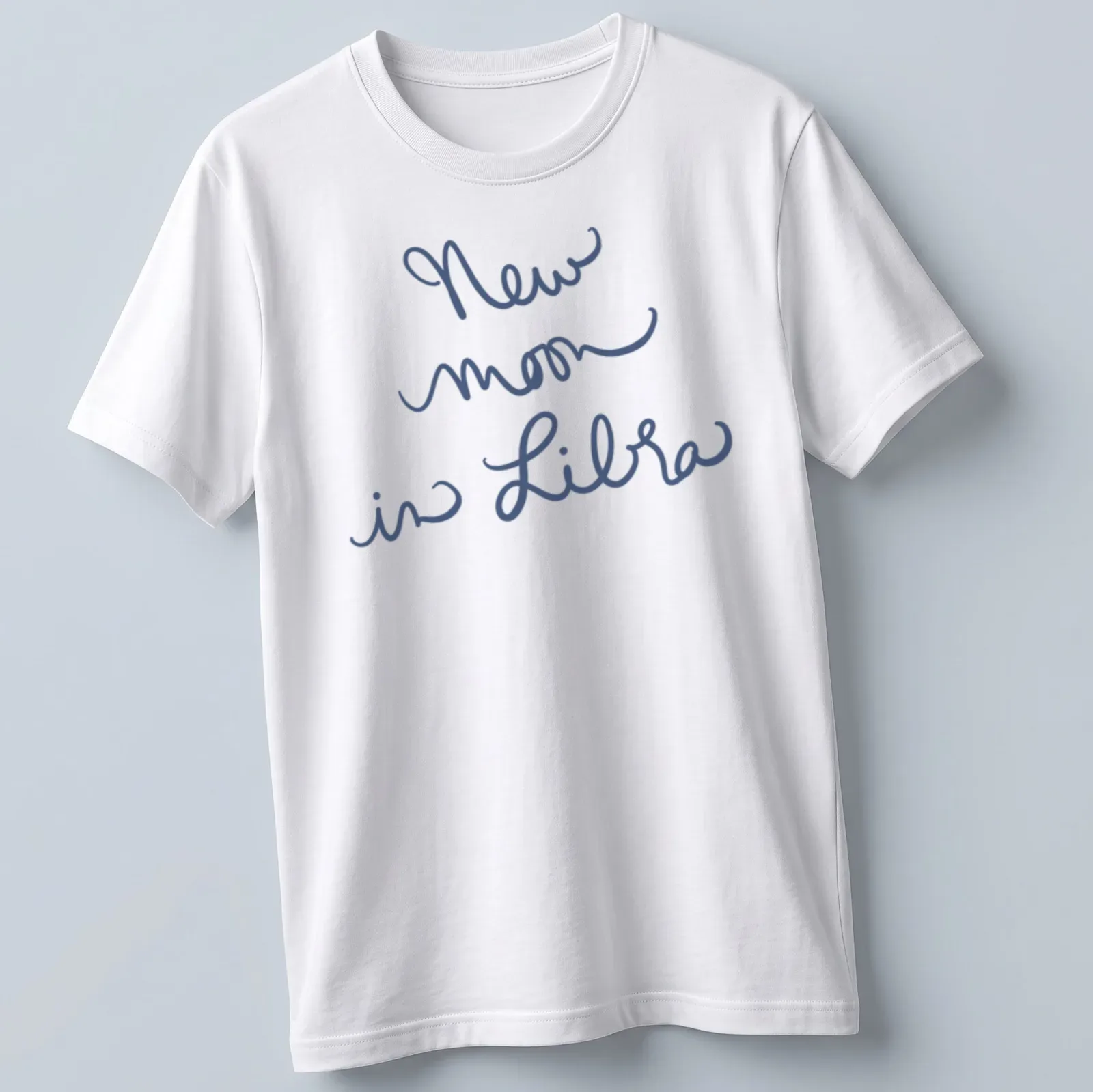 Handwritten script of 'New moon in Libra' on a navy blue — printed on a unisex t-shirt