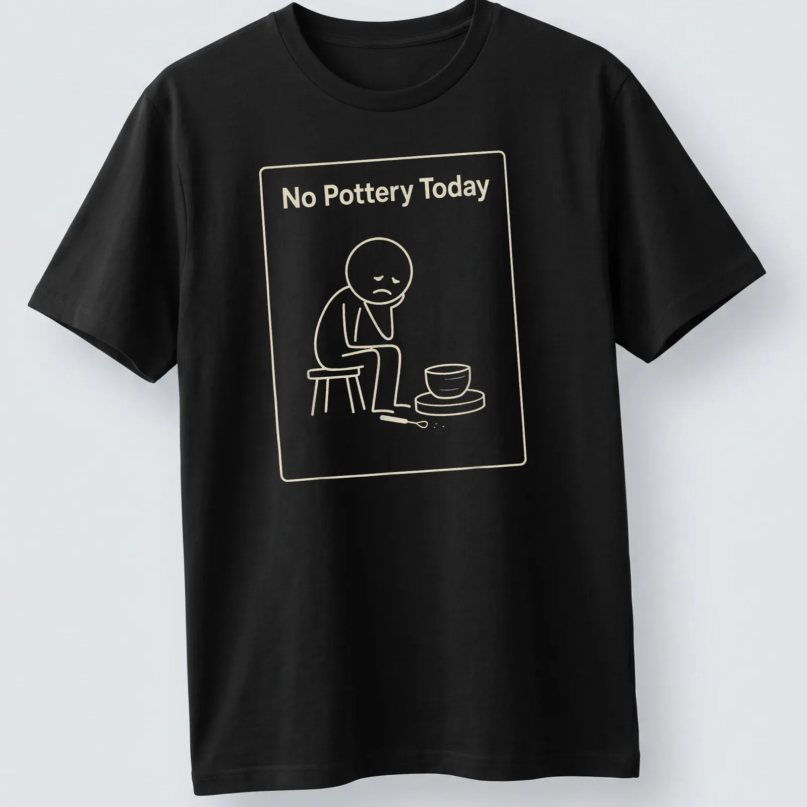 Line-art illustration of a sad potter with the phrase No Pottery Today — printed on a unisex t-shirt