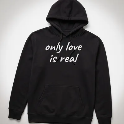 Elegant typography of 'only love is real' on a spiritual — printed on a unisex hoodie