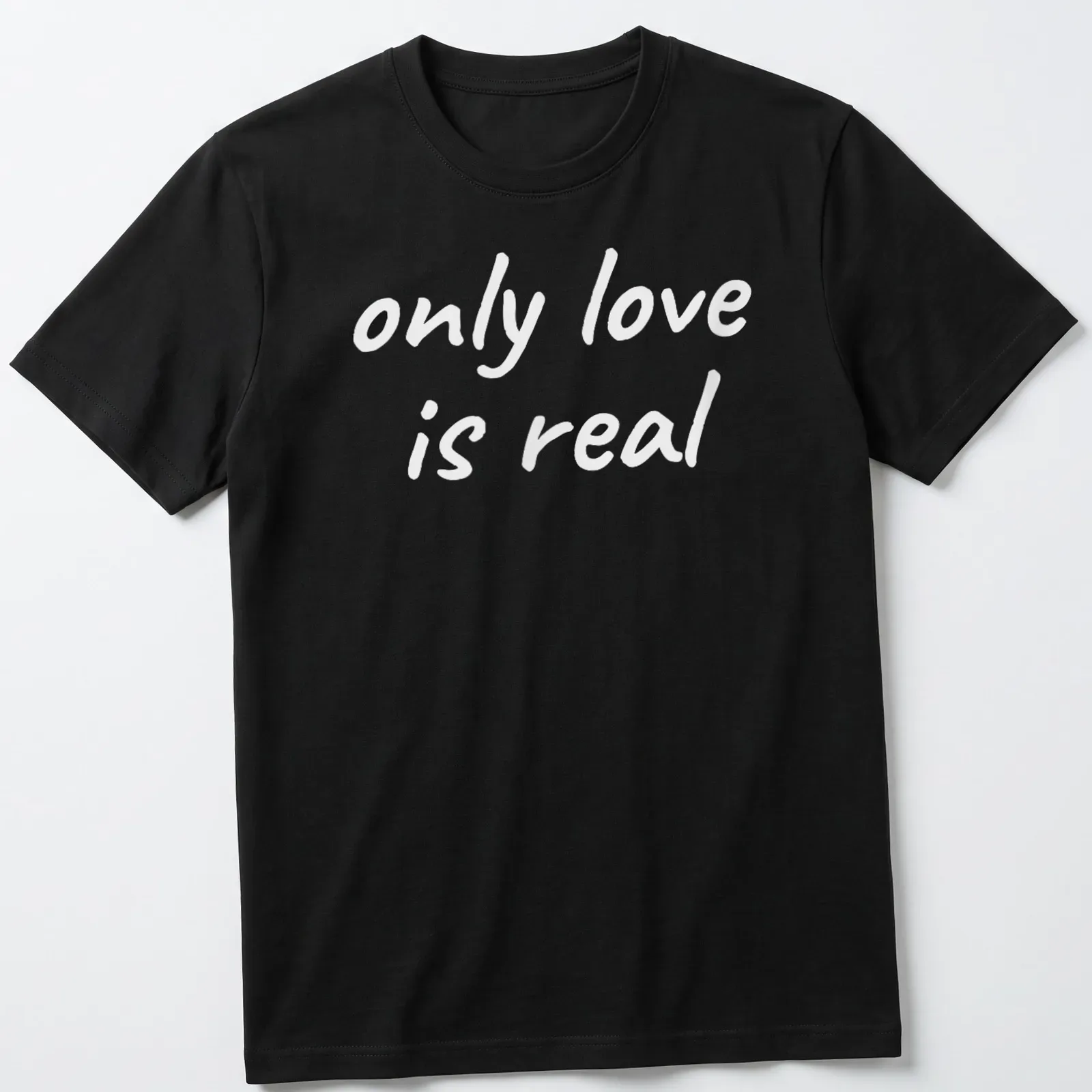 Elegant typography of 'only love is real' on a spiritual — printed on a unisex t-shirt