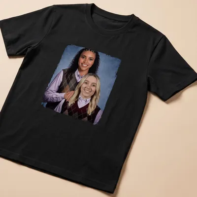 Photographic print of two women in basketball sweaters, featuring vibrant colors.
