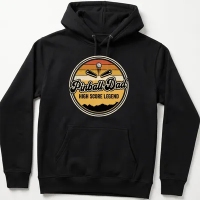 Retro arcade tee featuring a pinball machine with 'Pinball Dad HIGH SCORE LEGEND' text in vintage style — printed on a unisex hoodie