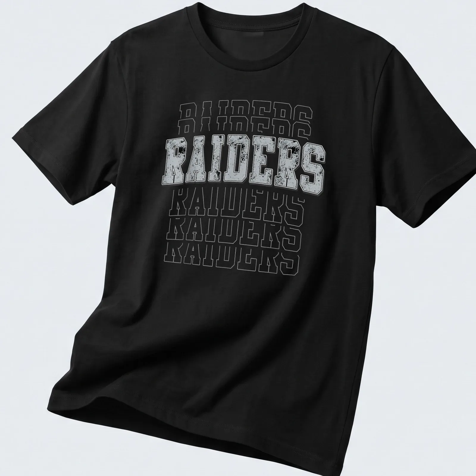 Vintage distressed Raiders t-shirt with bold lettering in gray, black, and white — printed on a unisex t-shirt