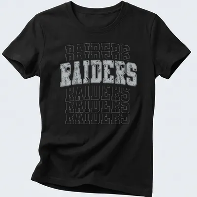 Vintage distressed Raiders t-shirt with bold lettering in gray, black, and white — printed on a women's shirt