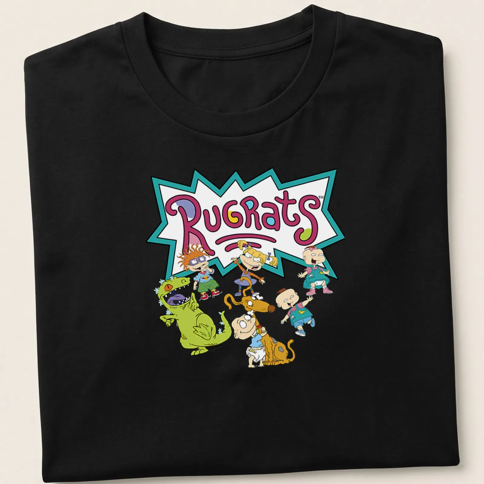 Colorful Rugrats cartoon characters t-shirt featuring the name in vibrant letters — printed on a unisex t-shirt