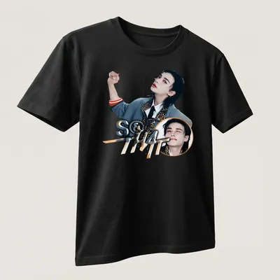 Playful graphic t-shirt featuring a young man and the text S&That in modern style — printed on a unisex t-shirt (angled view)