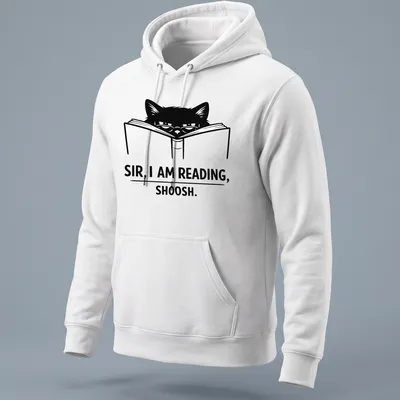 Bold line-art of a cat reading a book with text: 'SIR, I AM READING, SHOOSH.' — printed on a unisex hoodie