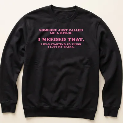 Bold slogan t-shirt featuring playful text in pink and white — printed on a unisex sweatshirt