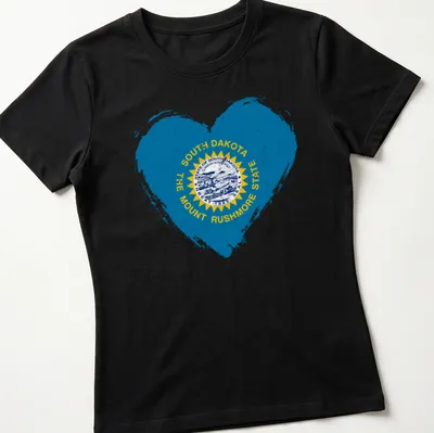Distressed heart design featuring the South Dakota state flag and text — printed on a women's shirt