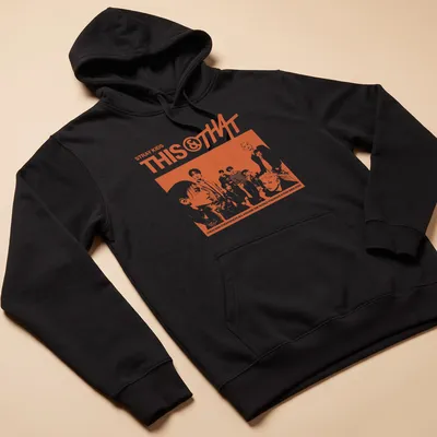 Retro Stray Kids shirt with vibrant orange text on white background — printed on a unisex hoodie