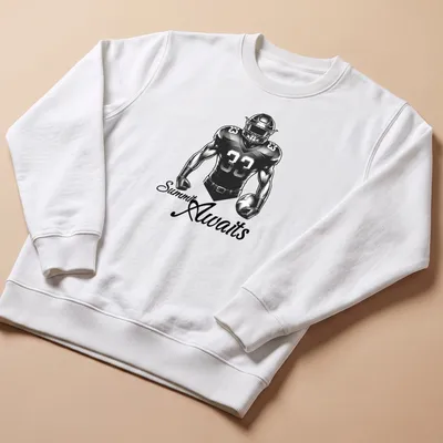 Bold monochrome football player t-shirt with the text 'Summit Awaits' in striking typography. — printed on a unisex sweatshirt