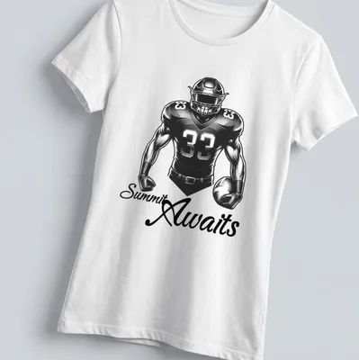 Bold monochrome football player t-shirt with the text 'Summit Awaits' in striking typography. — printed on a women's shirt