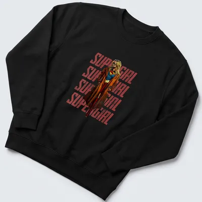 Vintage Supergirl design featuring repeated text in red, blue, brown, and yellow — printed on a unisex sweatshirt