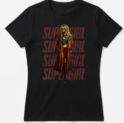 Vintage Supergirl design featuring repeated text in red, blue, brown, and yellow — printed on a women's shirt