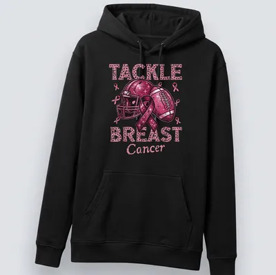 Colorful T-shirt featuring a football helmet and ball with a pink ribbon and awareness message — printed on a unisex hoodie