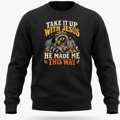 Vintage illustration of a raccoon with text: Take It Up With Jesus He Made Me This Way — printed on a unisex sweatshirt