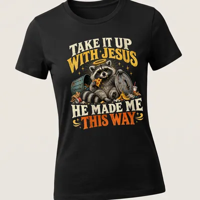 Vintage illustration of a raccoon with text: Take It Up With Jesus He Made Me This Way — printed on a women's shirt