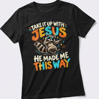 Vintage cartoon of a dancing raccoon with humorous text above it — printed on a women's shirt