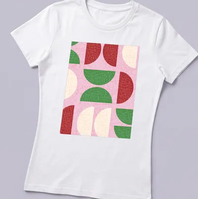Modern geometric design with textured semicircle shapes in shades of pink and green — printed on a women's shirt